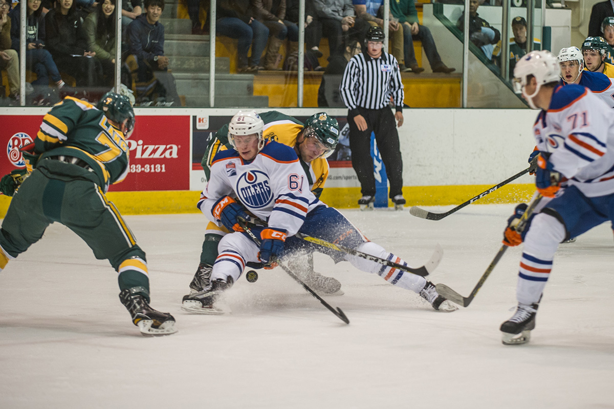 Sherwood Park native Braden Christoffer fights for possession. 