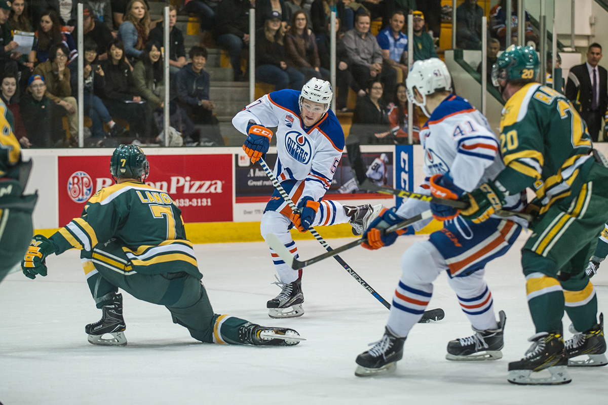 Collin Shirley, from Saskatoon, fires a shot at Bears defensemen Sawyer Lange. 