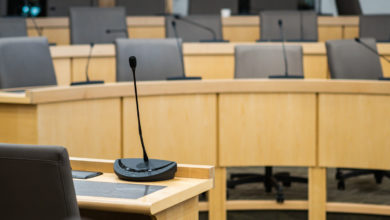 microphones and chairs in a council chamber