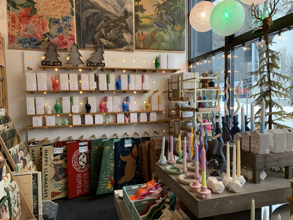 A photo of the wares in Shop Chop. Colourful candles can be seen.